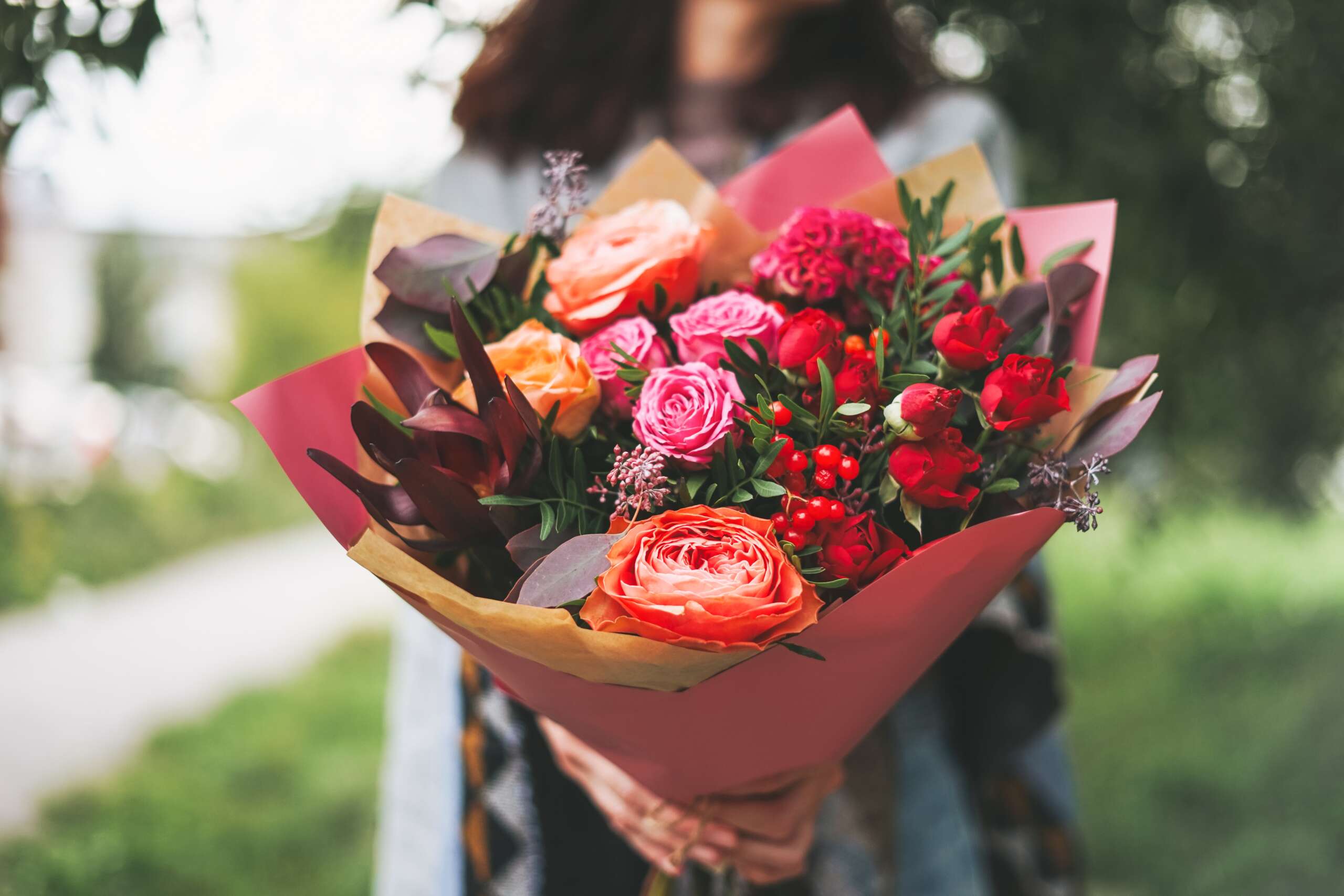 woman-holding-colorful-flower-bouquet-outdoors-2026-01-05-04-50-13-utc